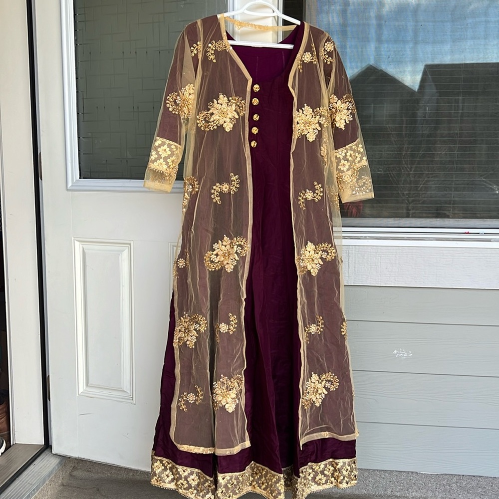 Indian style long fronk dress with a golden color embroidered cardigan.